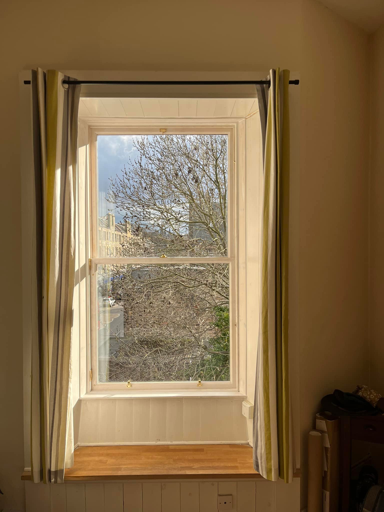 Sash windows looking out to city in the sun shine