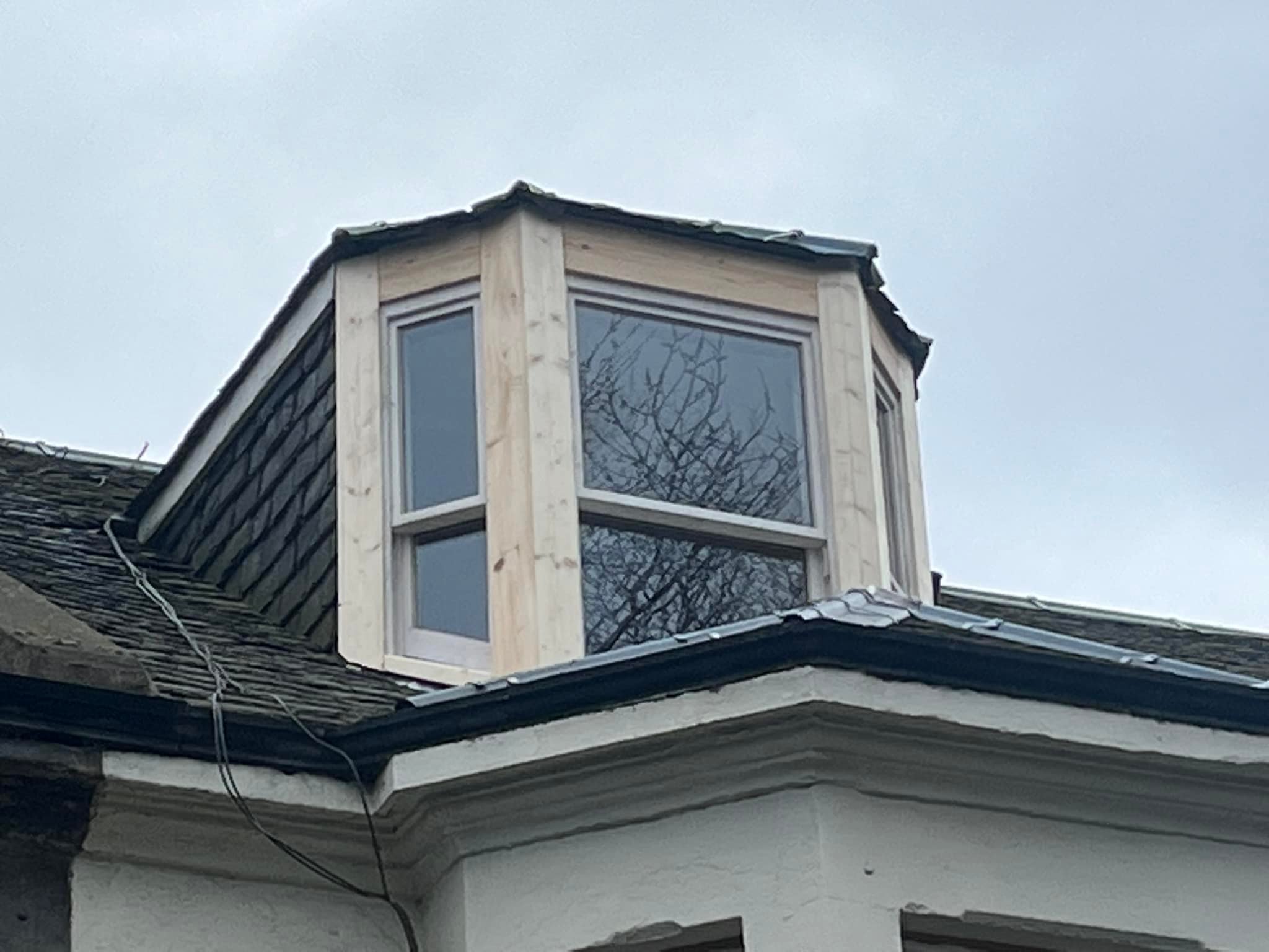 Extension in roof with Sash windows made of wood