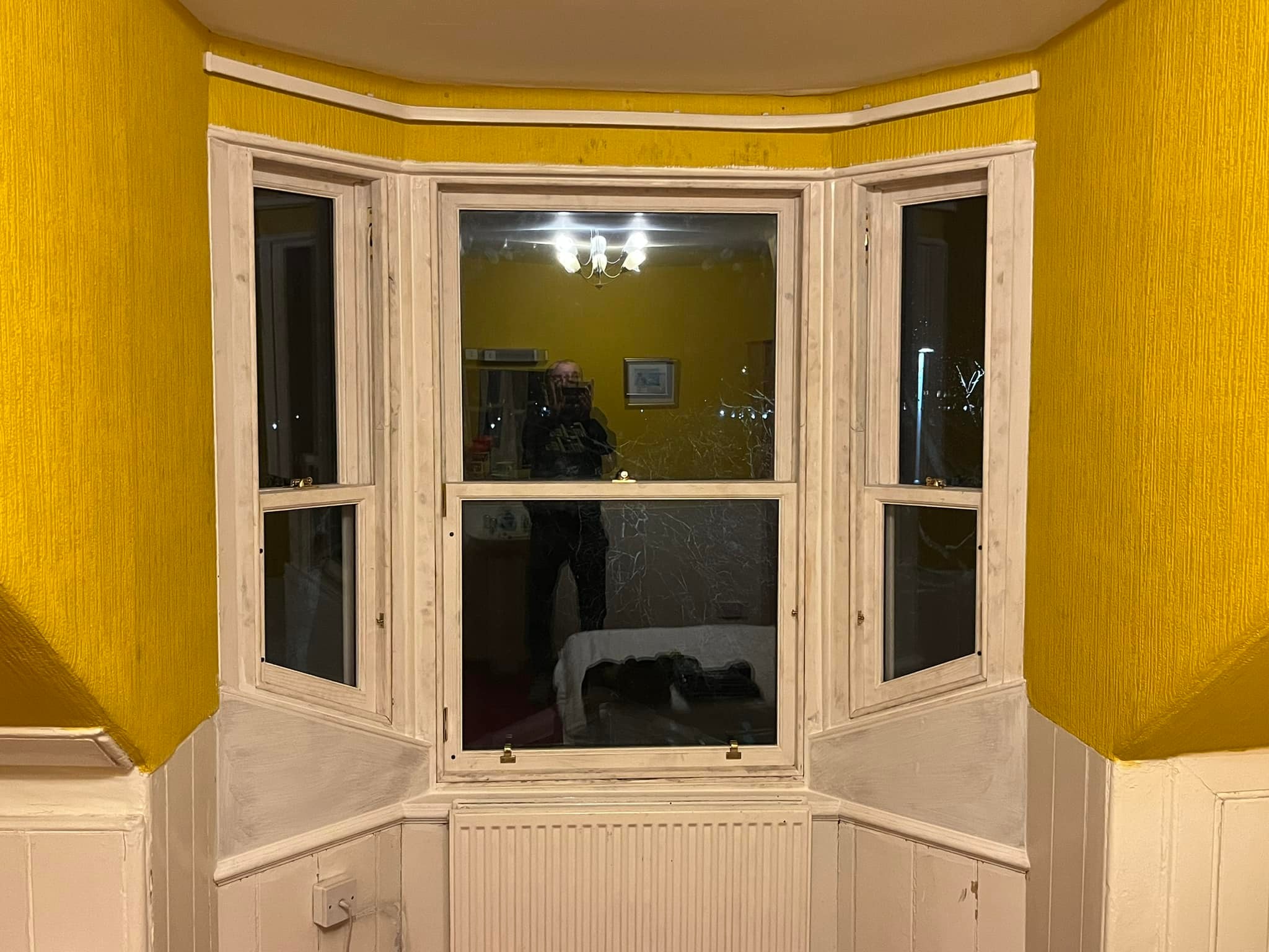 Sash window extension with yellow wall surround