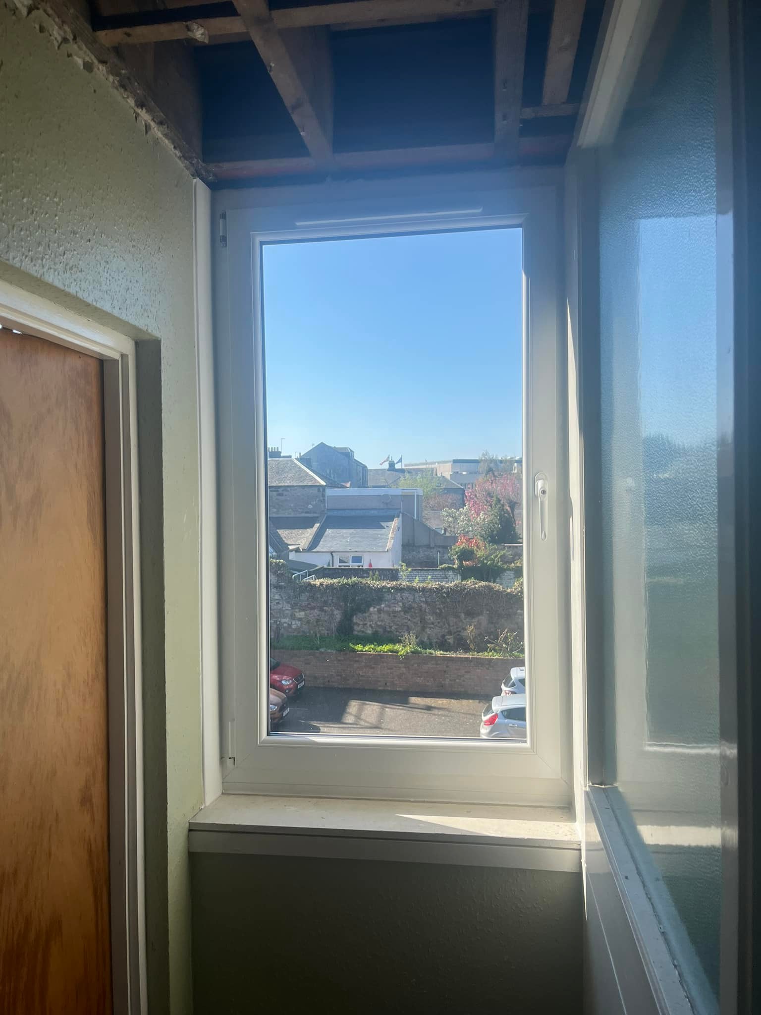 Narrow Case window looking out to car park