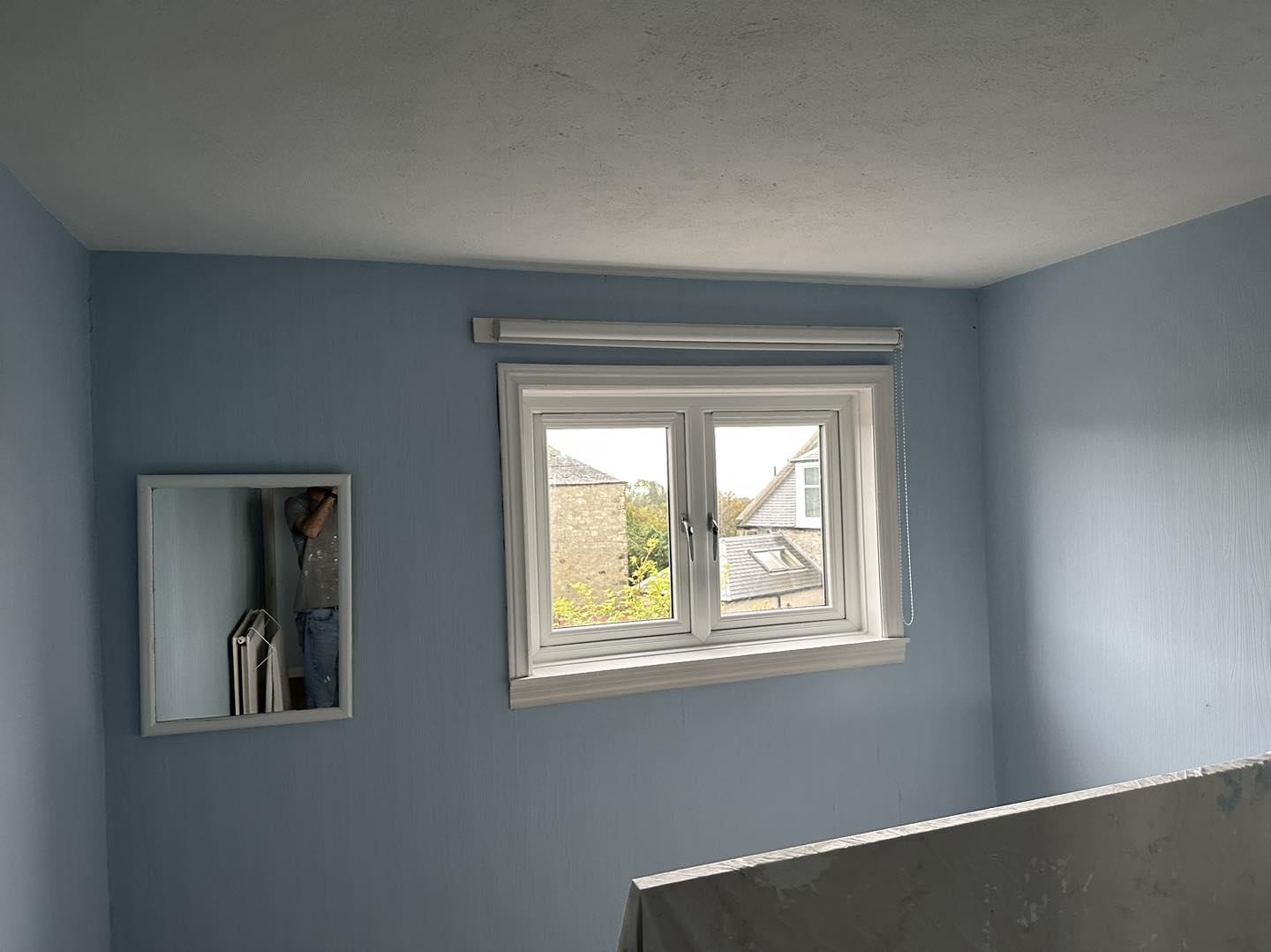 Double Case window looking out to other houses