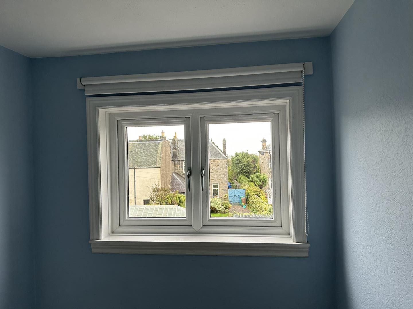 Double Case window looking out to other houses