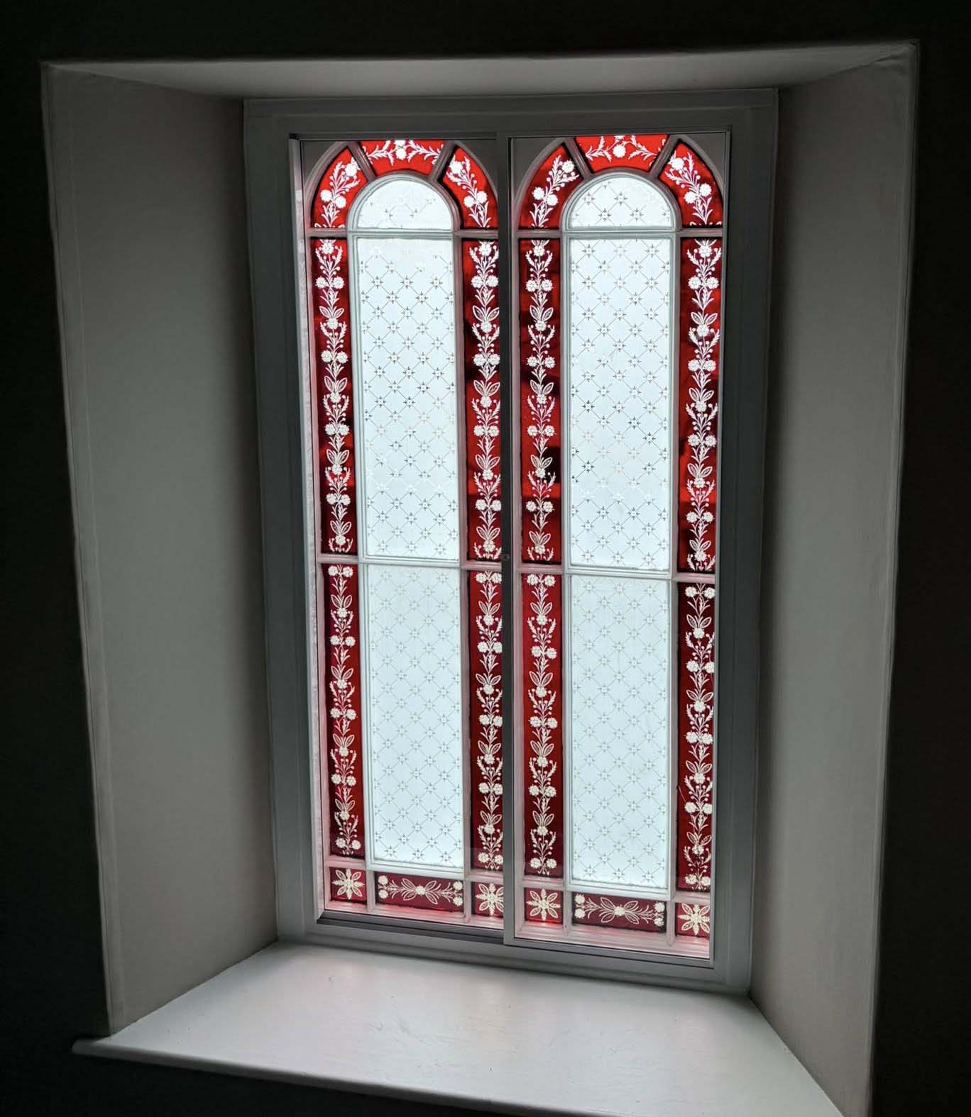 Stained glass windows with red design